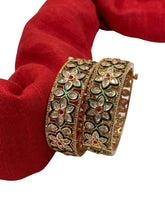 Beautiful Flower Design Polki Bangles With Green Enamel work.